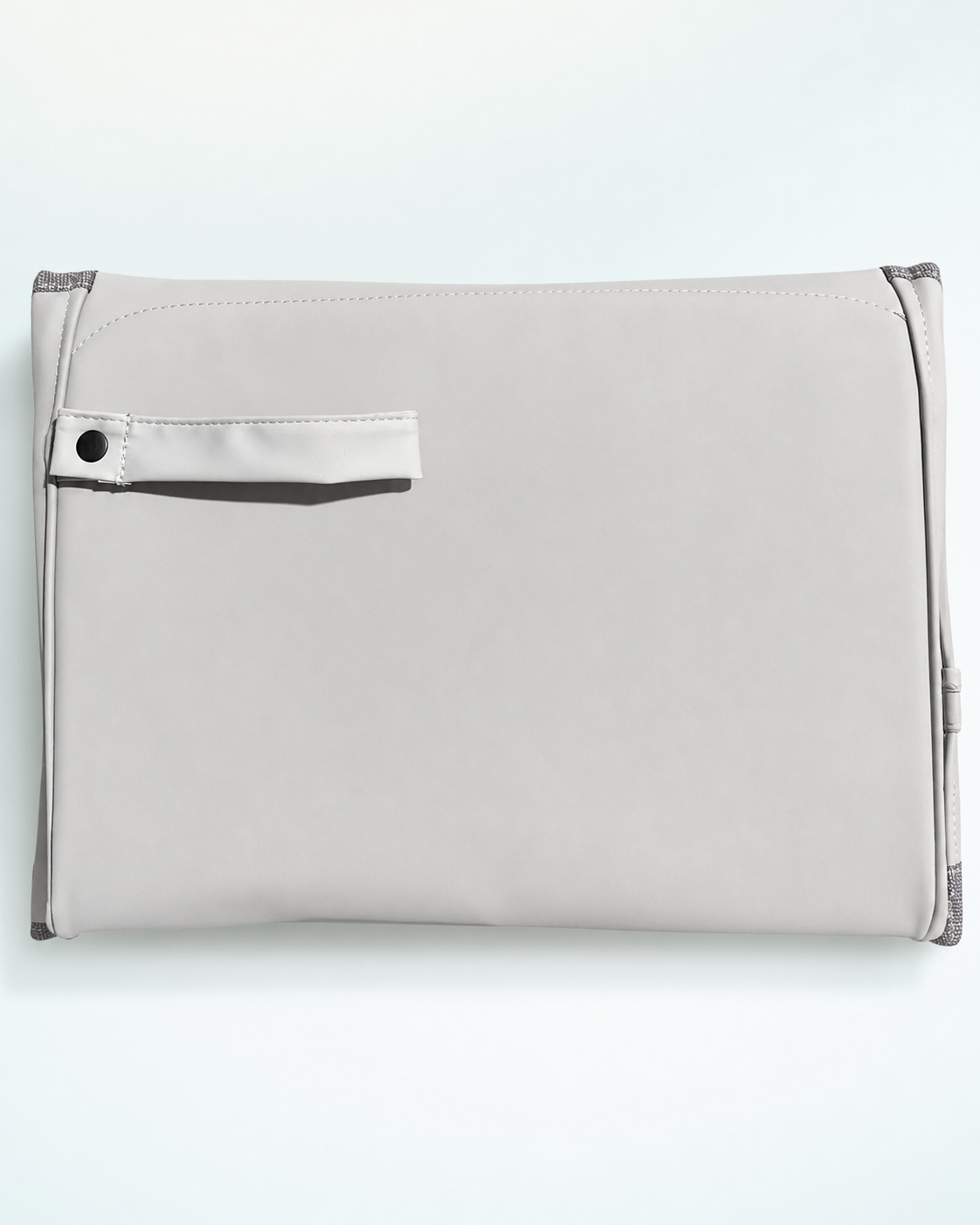 Back of the folded BabySafe changing pad showing the carrying strap